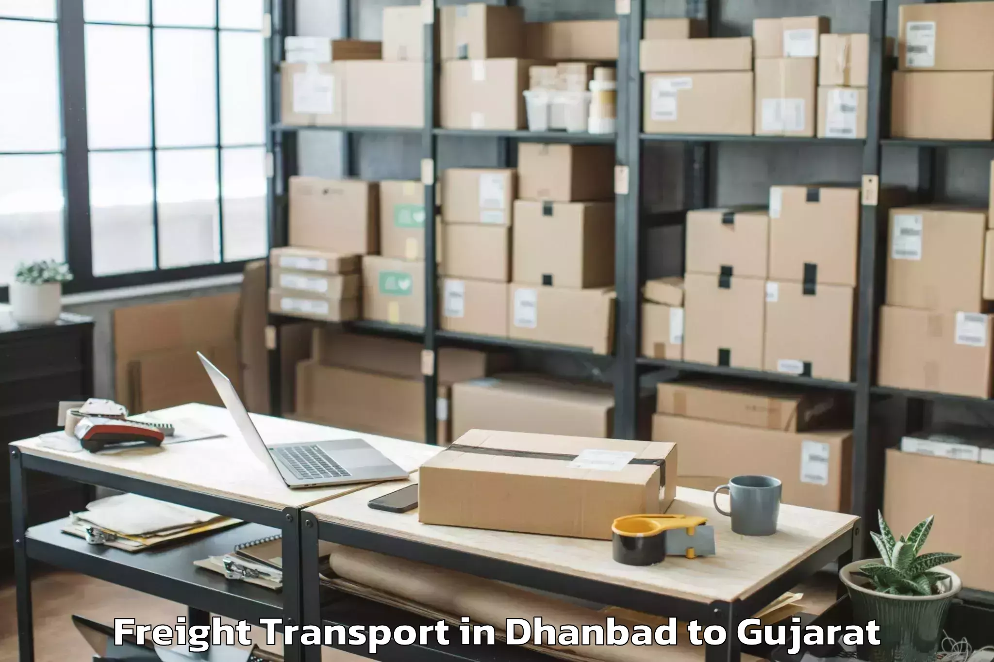 Get Dhanbad to Vaghodia Ina Freight Transport